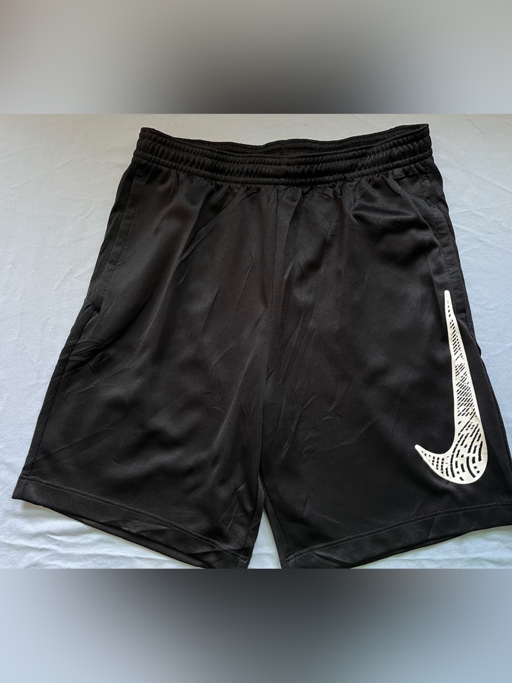 Nike Black Athletic Shorts with White Swoosh Accent